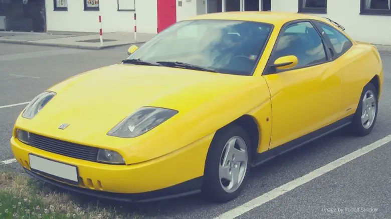 A yellow Fiat Coupe