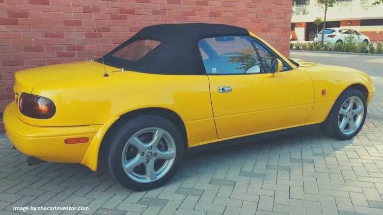 A yellow Mazda MX-5 (Miata)