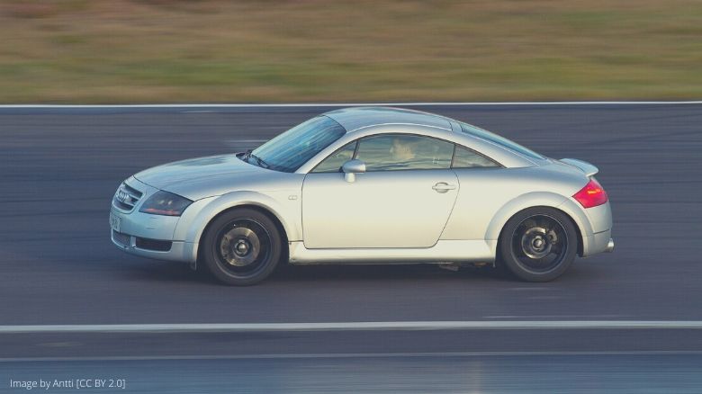 A silver Audi TT driving on a track