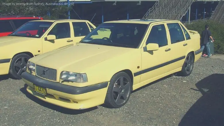 A yellow Volvo 850 R