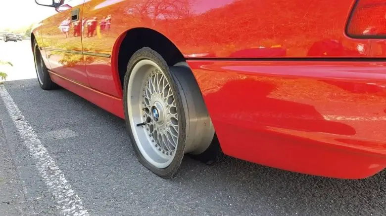 BMW 840 with a blown tire