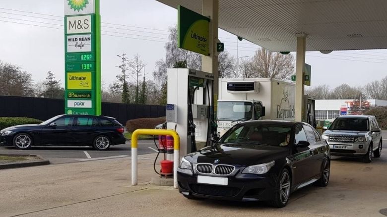 BMW M5 at a petrol station