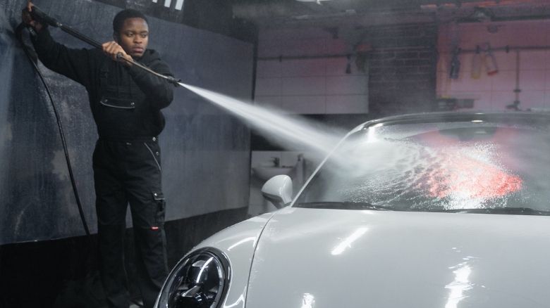 Jet washing a car
