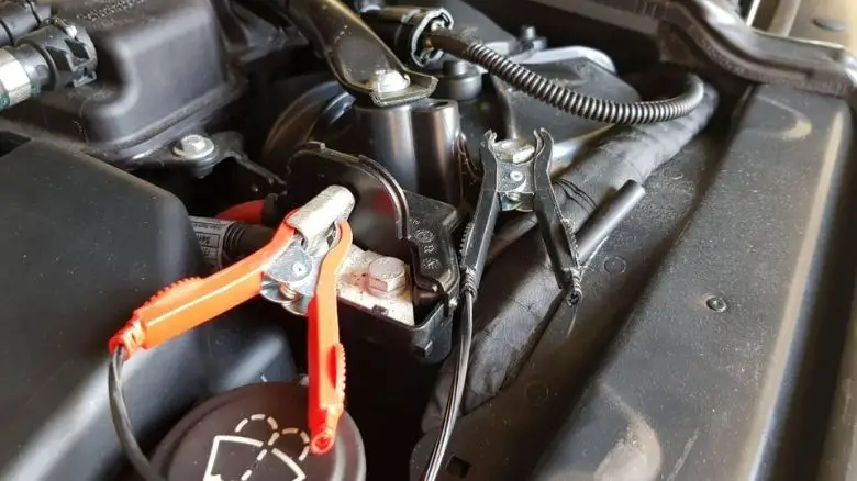 A trickle charger connected to a car's battery