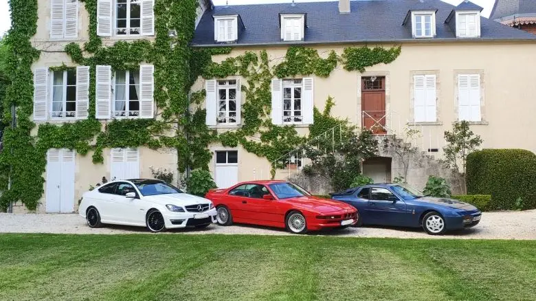 A Mercedes C63, BMW 840, and Porsche 944