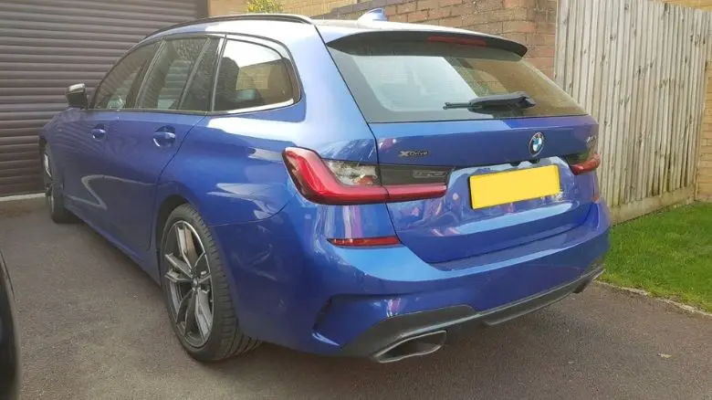 A blue BMW 3 Series wagon