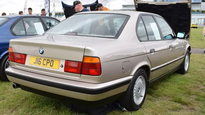 A beige BMW E34 5 Series