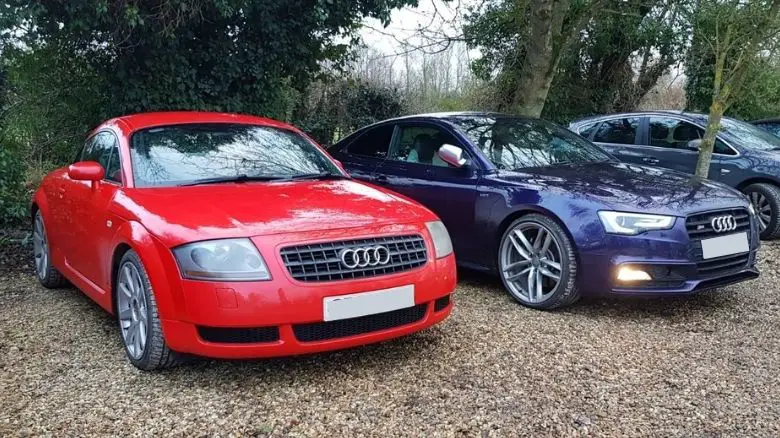 A red Audi TT and a purple Audi S5