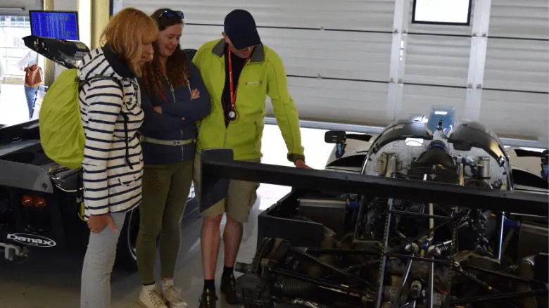 Examining a racing car engine