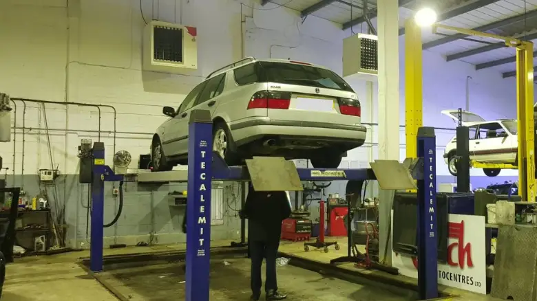 Garage inspecting car