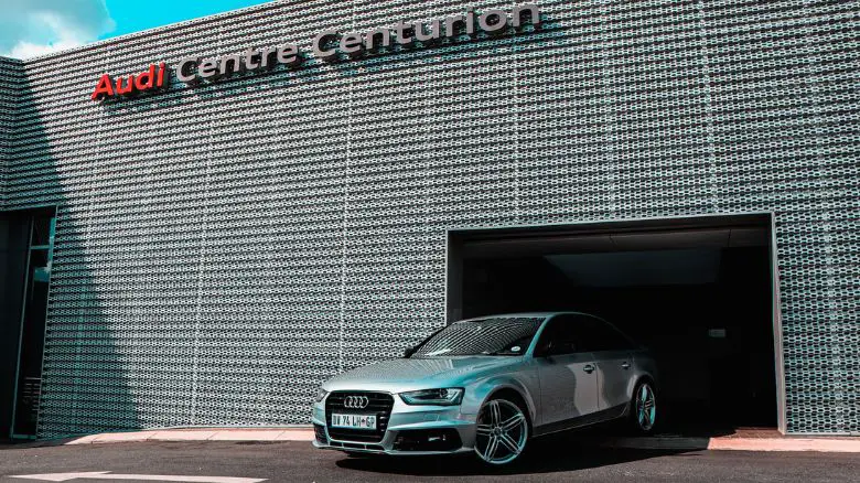 An Audi outside of an Audi dealership service centre