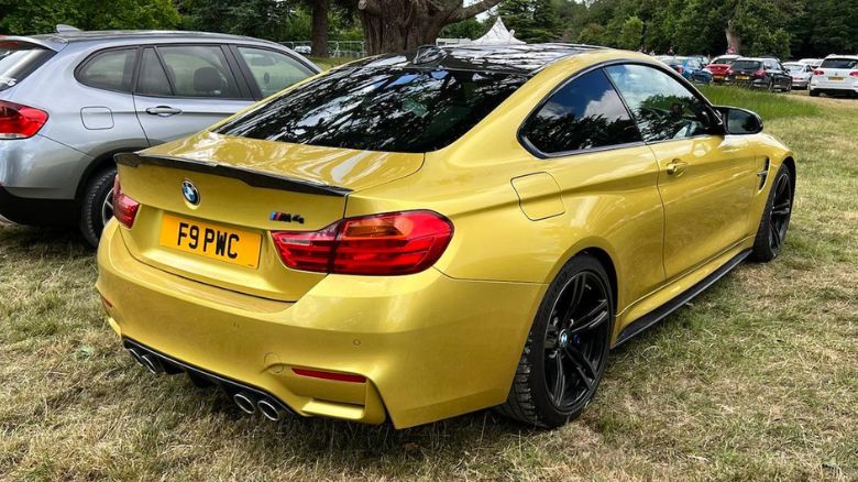 A yellow BMW M4