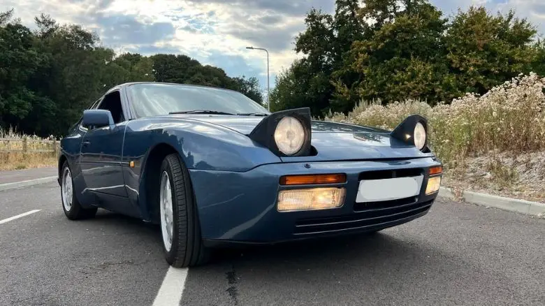 A Porsche 944 with its pop-up headlamps