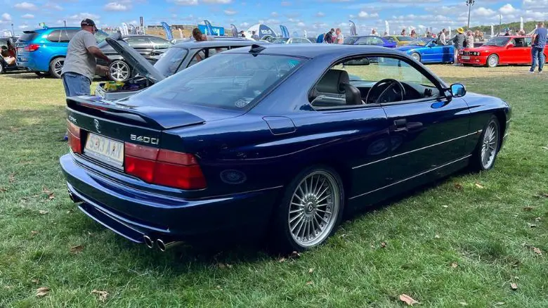 A blue BMW 840 (E31)