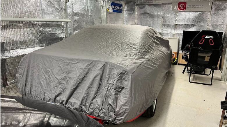 A BMW 8 Series covered for winter