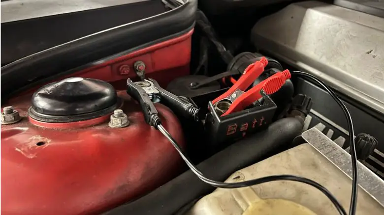 A trickle charger connected to a BMW 8 Series
