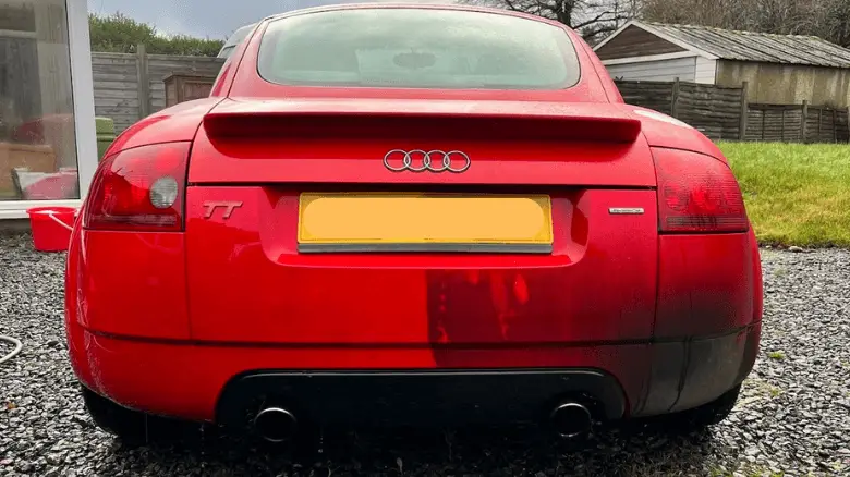 An Audi TT midway through a wash