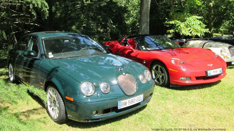 A Jaguar S-Type alongside a Corvette