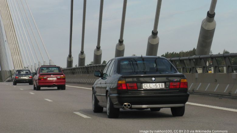 BMW M5s on a bridge