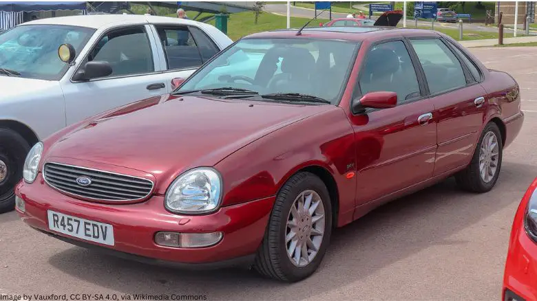 A red Ford Scorpio
